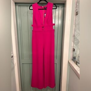 Hot pink cut out jump suit. NWT.
